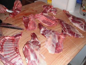 A frozen buffalo half carcass, showcasing the variety of cuts and rich red meat, ready for butchering and cooking.