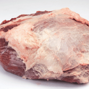 A frozen buffalo heart, displaying its rich red color and smooth surface, ready for cooking or preparation.