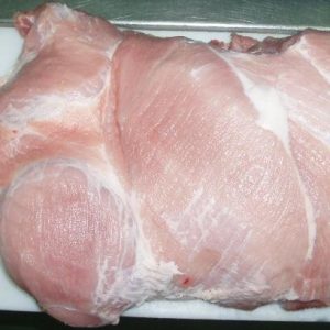 "Frozen boneless skinless pork leg packaged in a vacuum seal, ready for cooking."